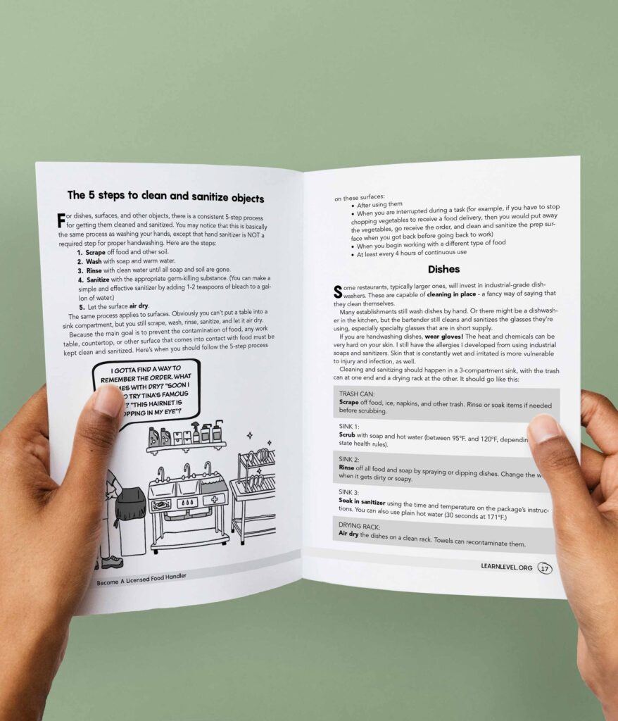 Hands holding an opened printed version of Level's guide Become A Licensed Food Handler