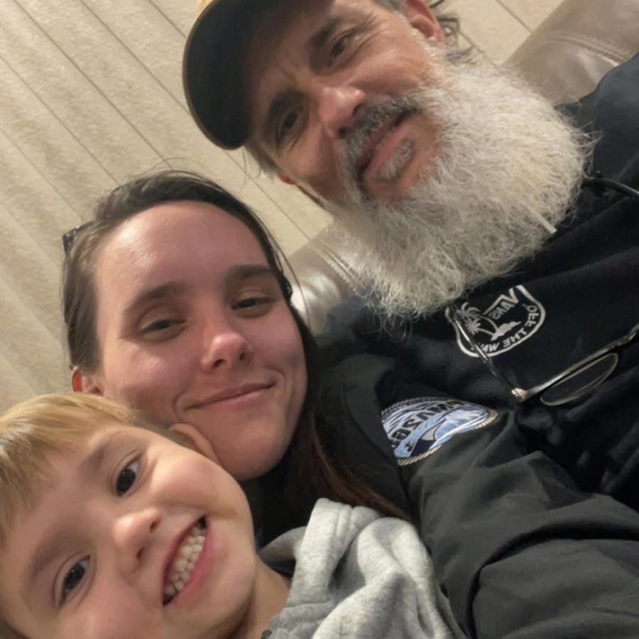 Ron, who used Level's prison education program while incarcerated, with his family members