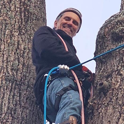 Ron, who used Level's prison education program while incarcerated, at his new tree service job